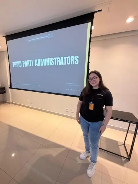 Nayane Bittencourt delivering an operational training presentation at an internal company event